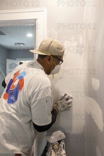 Detroit, Michigan - Workers remodel a house in the Morningside neighborhood that had been vacant for many years. Detroit lost nearly two-thirds of its residents from 1950 to 2020 but has been growing modestly in recent years