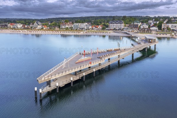 Aerial view over Seebrücke, pier and sandy beach at seaside resort Haffkrug along the Baltic Sea, Scharbeutz, Schleswig-Holstein, Germany