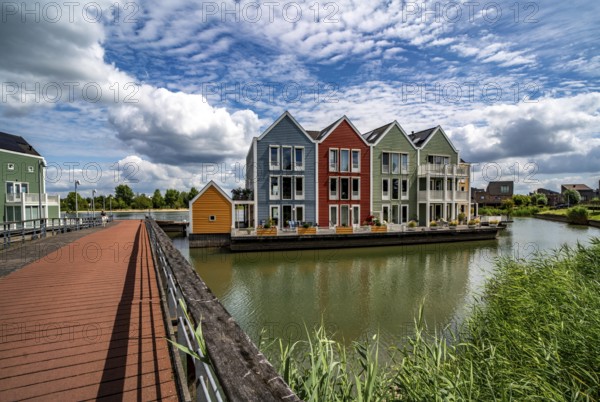 Small town of Houten near Utrecht, bicycles have priority in the town of 50, 000 inhabitants, generous cycle paths, many leisure areas, water areas, living by the water