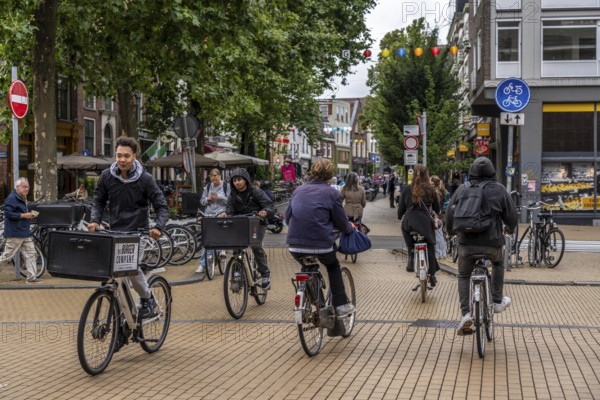 Cycling in the city centre of Groningen, old town, Netherlands