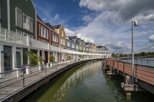 Small town of Houten near Utrecht, bicycles have priority in the town of 50, 000 inhabitants, generous cycle paths, many leisure areas, water areas, living by the water