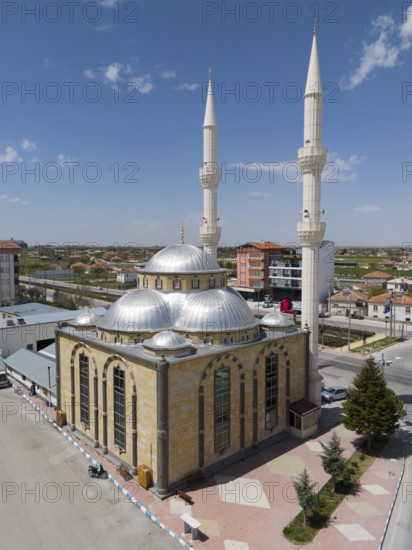 Modern mosque with two high minarets and several domes in an urban setting, aerial view, Mevlana Cami, Sultanhani, Sultanhani, Aksaray province, historic Silk Road, Turkey