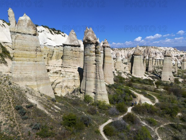 Impressive rock formations under a blue sky in Cappadocia with hiking trails, aerial view, Love Valley, Göreme National Park, Göreme Tarihî Millî Parki, Nevsehir province, Nevsehir, Cappadocia, Cappadocia, Cappadocia, Cappadocia, Central Anatolia, Turkey