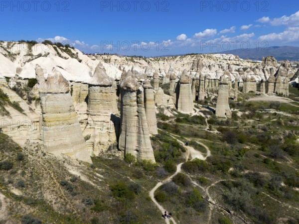 Panorama of imposing rocks and cliffs with a winding path in sunny surroundings, aerial view, Valley of Love, Göreme National Park, Göreme Tarihî Millî Parki, Nevsehir Province, Nevsehir, Cappadocia, Cappadocia, Cappadocia, Cappadocia, Central Anatolia, Turkey