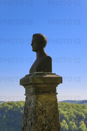 Hauff monument, bust of Wilhelm Hauff, monument modelled on the model of the Stuttgart sculptor Theodor Wagner, cast in ore. at Lichtenstein Castle, fairytale castle of Württemberg, romantic fairytale castle on the eaves of the Swabian Alb, Honau, municipality of Lichtenstein, Baden-Württemberg, Germany