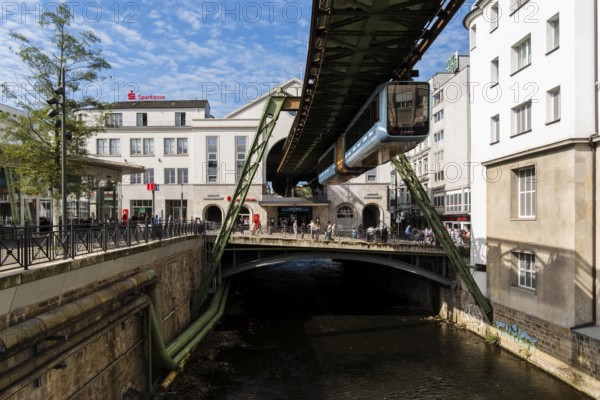 The Wuppertal suspension railway arrives at the Döppersberg stop in the city centre of Wuppertal, Germany