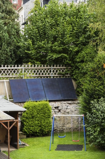 Solar panels on a wall in a garden in Wuppertal, Germany