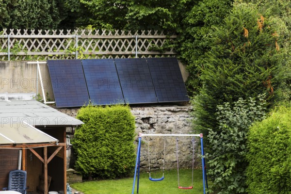 Solar panels on a wall in a garden in Wuppertal, Germany