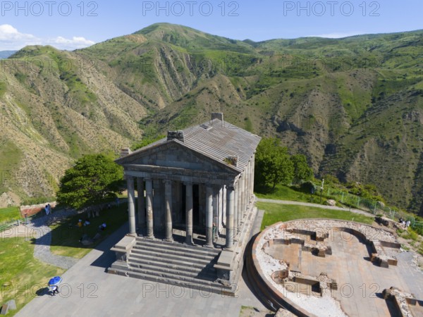Ancient temple on a hill overlooking a green mountain landscape, aerial view, Temple of Garni, Garni, Kotayk province, Armenia