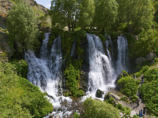 Several waterfalls surrounded by dense greenery and trees, aerial view, Shaki waterfall, Shaki, Syunik province, Armenia