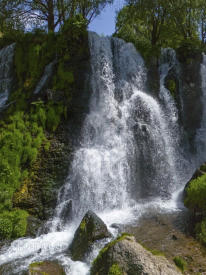 Close-up of a waterfall with splashing water and moss, aerial view, Shaki waterfall, Shaki, Syunik province, Armenia