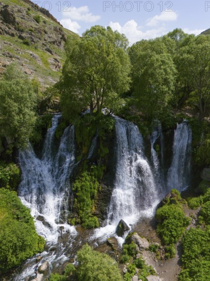 Large waterfall in mountainous surroundings with lush vegetation, aerial view, Shaki waterfall, Shaki, Syunik province, Armenia