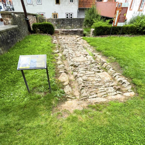 Archaeological find of original small section with old stones from historic trade route between Frankfurt am Main and Leipzig, Steinau an der Straße, Hesse, Germany, relocated to secure protected site in Steinau an der Straße
