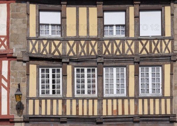 Close-up of a half-timbered house with beige and brown elements, Tréguier, Brittany, France