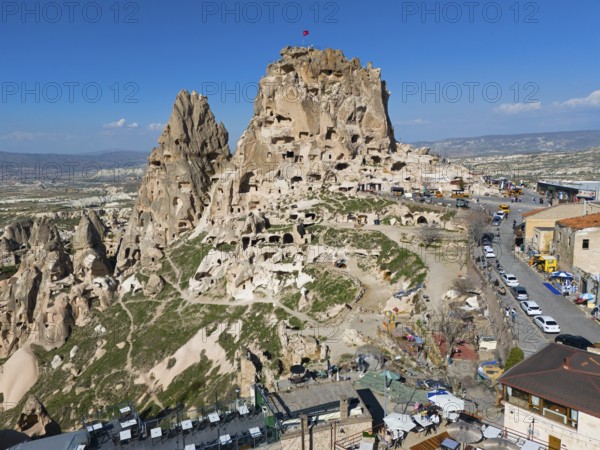 Historical rock formation with caves and buildings under a clear blue sky in a vast landscape, aerial view, Uchisar Castle, Uçhisar Kalesi, impressive rock formation and fortress, Göreme National Park, Göreme Tarihî Millî, Nevsehir Province, Nevsehir, Cappadocia, Cappadocia, Kapadokya, Cappadocia, Central Anatolia, Turkey