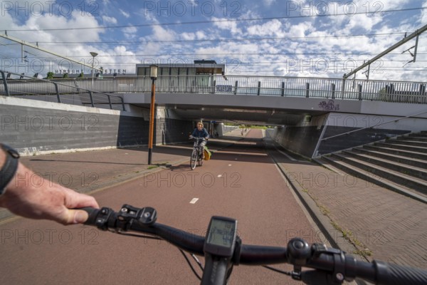 Cycle path in the east of Utrecht, subway of the railway line, at Utrecht-Lunetten station, Maarschalkerweerdpads, inner-city cycle path, wide, part of a cycle path network, Netherlands