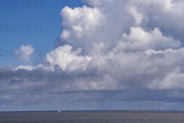 Wadden Sea between the Dutch coast near Eemshaven and the German North Sea island of Borkum, Wadden Sea National Park, UNESCO World Heritage Site, low tide, low water, clouds