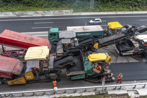 Rehabilitation of the A52 motorway near Essen, an 8 km long section between the Essen-Kettwig junction and the Essen-Ost motorway junction was completely renovated over a period of 9 years, 6 lanes, new drainage pipes, carriageway, bridges, noise barriers, traffic facilities, here the last section, direction Düsseldorf, new carriageway surface, laying of porous asphalt, whispering asphalt, at the Essen-Rüttenscheid junction, North Rhine-Westphalia, Germany