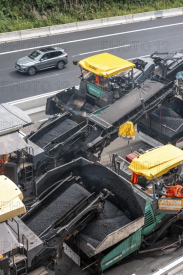 Rehabilitation of the A52 motorway near Essen, an 8 km long section between the Essen-Kettwig junction and the Essen-Ost motorway junction was completely renovated over a period of 9 years, 6 lanes, new drainage pipes, carriageway, bridges, noise barriers, traffic facilities, here the last section, direction Düsseldorf, new carriageway surface, laying of porous asphalt, whispering asphalt, at the Essen-Rüttenscheid junction, North Rhine-Westphalia, Germany