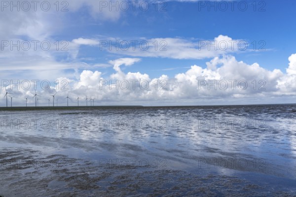 Wadden Sea between the Dutch coast near Eemshaven and the German North Sea island of Borkum, Wadden Sea National Park, UNESCO World Heritage Site, low tide, wind farm, low tide, clouds