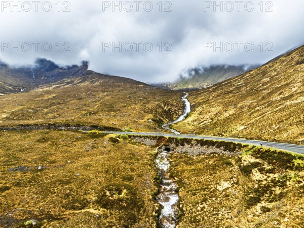 Eas a' Bhradain Waterfall from drone, Red Cuillin mountains, Loch Ainort, Isle of Skye, Scotland, UK