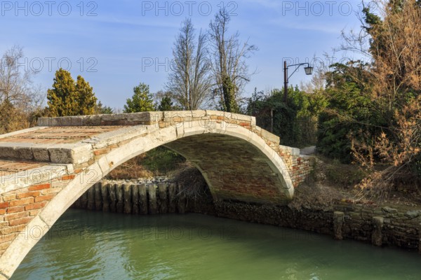 Devil's Bridge, Ponte del Diavolo, arched stone bridge over canal, Venetian arch bridge, medieval construction, landmark, Torcello Island, Venice Lagoon, Veneto, Italy