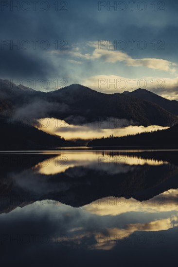 Sunrise with reflections in the Plansee in Tyrol in the Alps in Austria