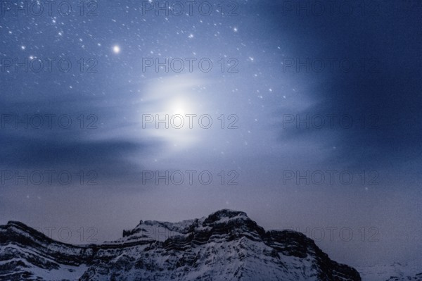 Starry sky during a winter road trip on the Icefields Parkway with lots of snow and ice, Banff National Park, Jasper National Park, Alberta, Canada