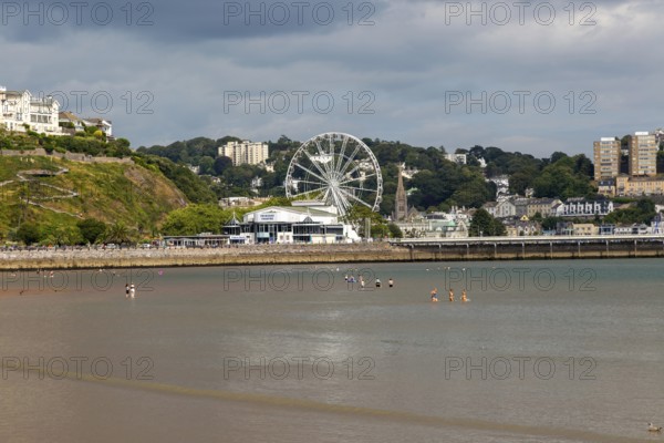 View to Princess Theatre and Ferris Wheel, Torre Abbey Sands sandy beach, Torquay, Devon, England, UK