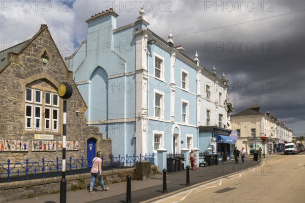 Dark storm clouds pass over historic buildings, Queen Street, Newton Abbot, Devon, England, UK