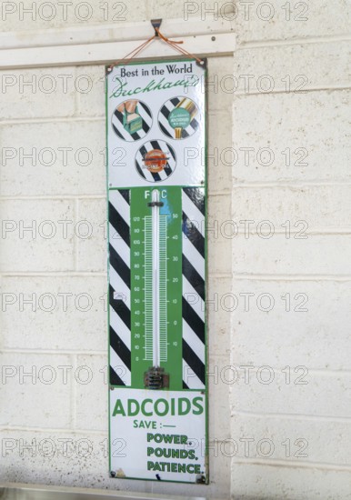 Wall thermometer advertising Duckhams Adcoids engine oil 1930s, on display at auction, UK