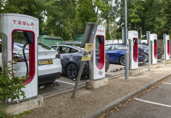 Charging point facility for Tesla electric vehicles at service station, M25 South Mimms services, Hertfordshire, England, UK
