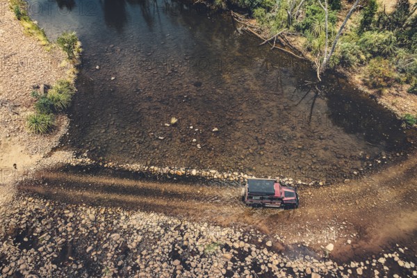 Landrover crosses river in Australian outback in the Kimberley, North West Australia, Australia
