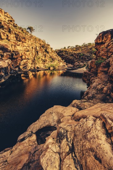 Bell Gorge waterfall, a body of water in north-west Australia in the Kimberley. Sunrise in the outback, Australia