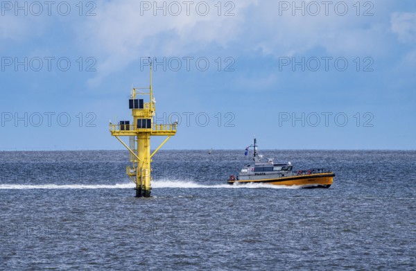 Pilot boat, Milo, pilot boat, brings sea pilots, ship pilots, to the ships to ensure safe entry and exit to the harbour, here in front of the Eemshaven seaport, Ems estuary, Netherlands