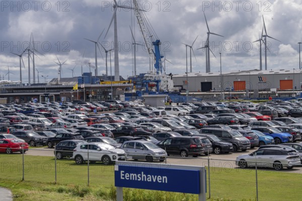 Car park at the ferry port of Eemshaven, in the Ems estuary ferry to the German North Sea island of Borkum, by AG Ems Nederland B.V., Borkumlijn, short and long-term car park, industrial port, power plants, wind farm, Netherlands