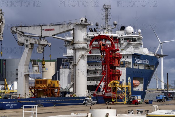 The seaport of Eemshaven, Julianahaven Basin, where the foundation structures, monopiles, for offshore wind farms are stored, which then support the actual wind turbines, the components are transported to the wind farms in the North Sea on large workboats and anchored to the seabed, where the wind turbines are then built, Eemshaven, Netherlands