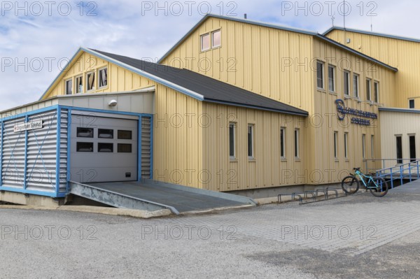 Hospital, yellow wooden house, Longyearbyen, Spitsbergen, Svalbard