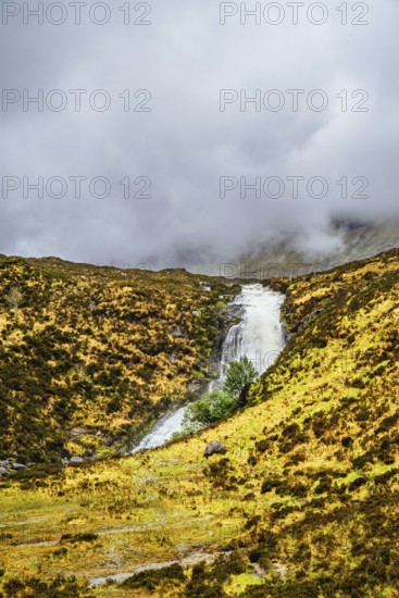 Eas a' Bhradain waterfall, Red Cuillin mountains, Loch Ainort, Isle of Skye, Scotland, UK