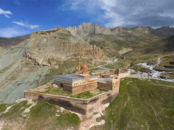 Old fortress embedded in dramatic mountain scene with cloudy sky and rocky heights, aerial view, Ishak Pasha Palace, Ishak Pasha Palace, Ishak Pasa Sarayi, Ottomans, Dogubayazit, Dogubayazit, Dogubeyazit, Agri Province, Agri, Eastern Anatolia, Anatolia, Turkey