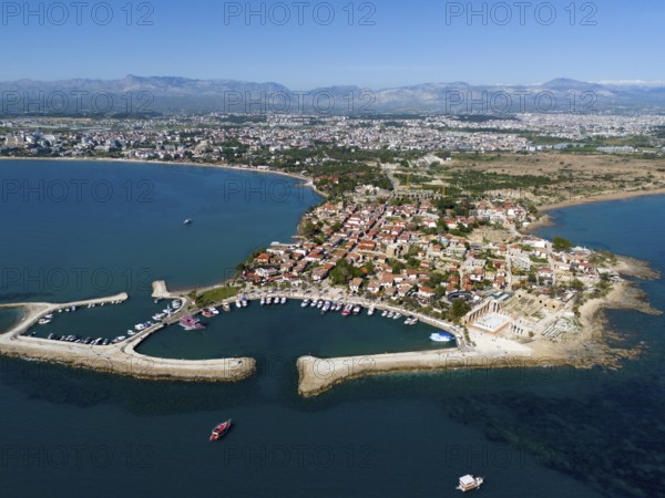Aerial view of a coastal town with boat harbour. Mediterranean houses and blue sea, aerial view, harbour and Temple of Apollo, Side, Manavgat, Antalya province, Turkey