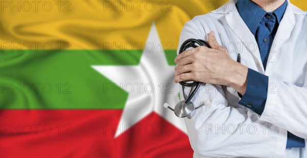 Doctor with stethoscope on Myanmar flag. Doctor holding stethoscope on Myanmar flag