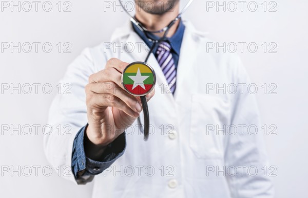 Myanmar healthcare system, doctor holding stethoscope. Myanmar health and medical insurance concept