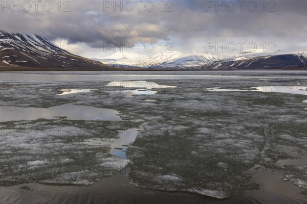 Ice on water, frozen lake, Aventdalen, Longyearbyen, Spitsbergen, Svalbard