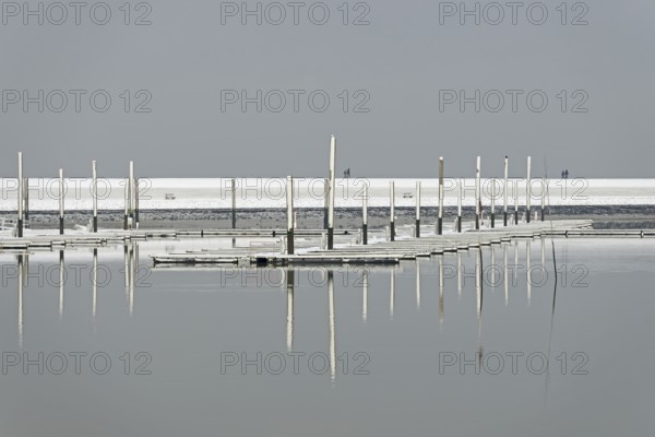 Winter day, onset of winter, snow on the jetties in the marina, North Sea, Norddeich, Lower Saxony, Germany