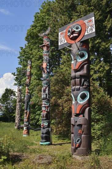 Totem poles, Chief Skedans Mortuary Totem Pole and Ga'akstalas Totem Pole, Stanley Park, Vancouver, British Columbia, Canada