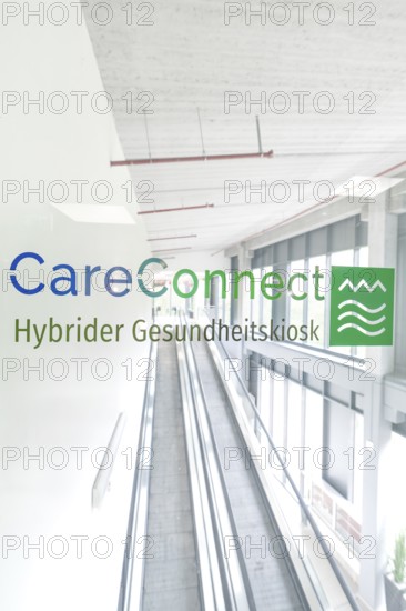 Bright escalator system with CareConnect logo in modern style, Care Connect, vaccination kiosk for refugees, Calw, Germany