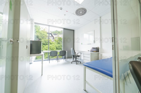 Modern office with large window and view of nature, Care Connect, vaccination kiosk for refugees, Calw, Germany