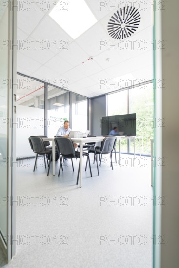Modern conference room with large table, chairs and large windows, Care Connect, vaccination kiosk for refugees, Calw, Germany