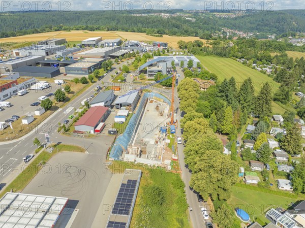 Aerial view of a construction site in a rural industrial landscape, car park construction, Calw, Germany